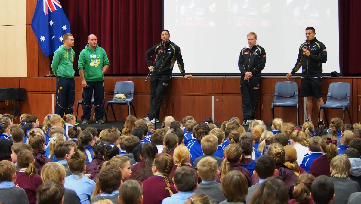 KINGS OF THE KIDS: Penrith Panthers NRL stars at the Cathedral School before last year’s NRL clash in Bathurst. Ticket sales for the Panthers' game this year are sluggish.	 072414znrl3