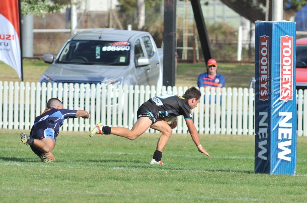 STAR: Nick Loader goes over for one of his four tries. Photo: JUDE KEOGH 	0410hawks10 