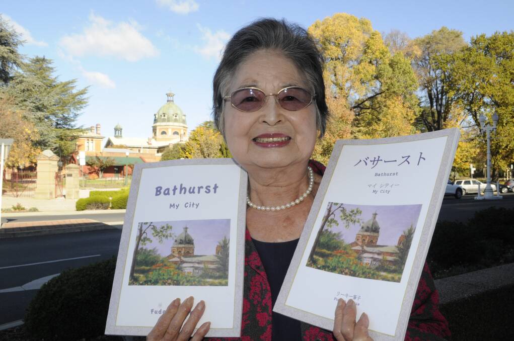 BATHURST THROUGH ART: Resident Fudeko Reekie has created Bathurst – My City, to be published in both English and Japanese, as a unique guide to key buildings, landmarks and landscapes in Bathurst. Photo: CHRIS SEABROOK	 052416cfudeko