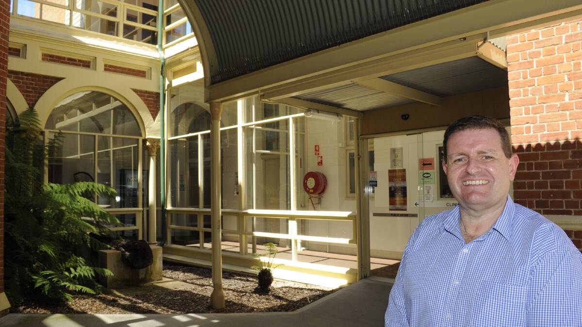 COME ON IN: Western NSW Primary Health Network CEO Andrew Harvey outside the entrance to the after hours GP clinic at Bathurst Hospital. Photo: CHRIS SEABROOK	 020816clinic1