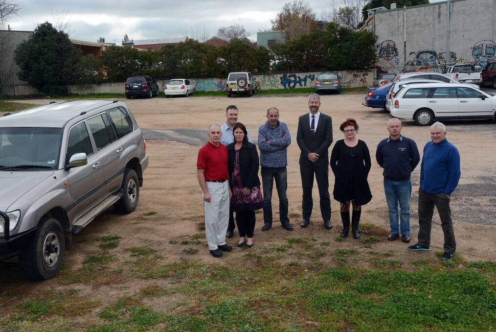 DISAPPOINTMENT: Keppel Street business owners George Mason, Peter Wright, Vicki Mason, Chris Carslake, Ben Whitwell, Sue Schafer, Keith Illingworth and Peter Gregan.	061714pkeppel2