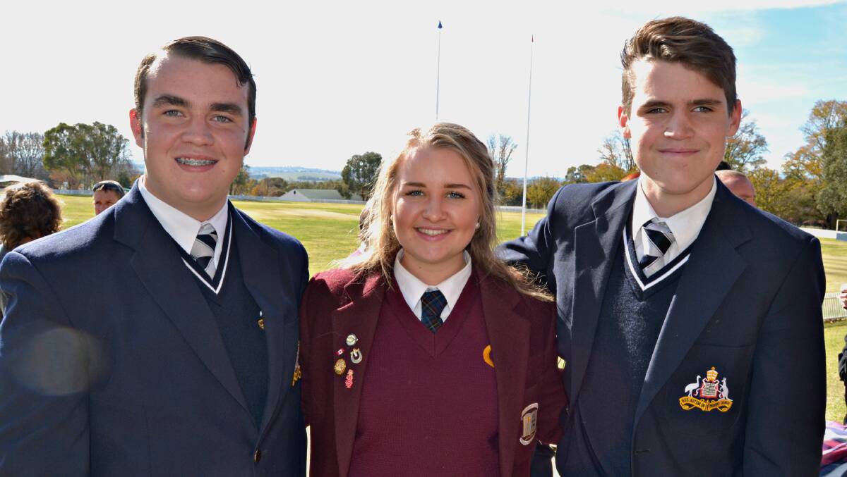 EMBRACING THE FUN: Students Thomas Parker and Harrison Selmes, from St Stanislaus’ College, and MacKillop College student Lily O’Toole, all in Year 10, enjoyed participating in the CWA public speaking competition that was held at All Saints’ College yesterday. Photo: RACHEL FERRETT 	053116rfcwa1