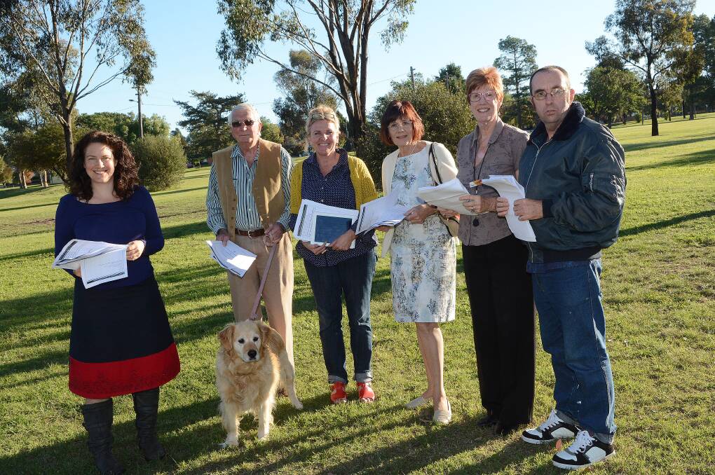SPEAKING THEIR MIND: Fiona Green, Allan Aylward (with Holly), Bernadette Wood, Melody Bland, Andrea Nyeboer and Nathan Deacon, who all live near Centennial Park, are having their say on the future of the area. Photo: PHILL MURRAY 	041714ppark 
