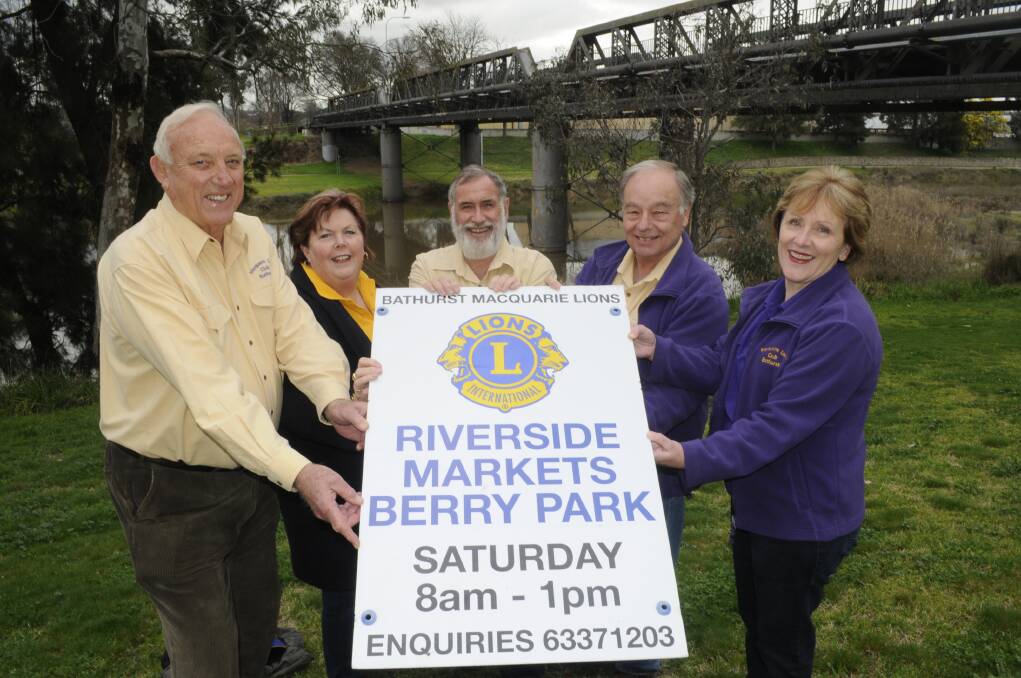 NEW LOOK, NEW NAME: Bathurst Macquarie Lions members John Fish, Sue Longmore, president Graham Carter, Michael and Judy Ryan show off the new signage for the re-branded markets at Berry Park. Photo: CHRIS SEABROOK	 082615cmarkets