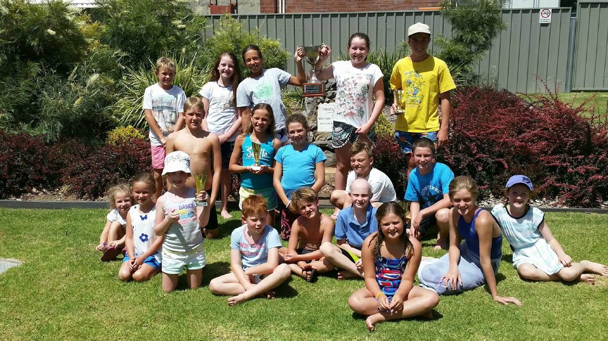 CELEBRATION: Bathurst Amateur Swim Club members celebrate taking out the Mountains and Plains Summer Championships over the weekend at Parkes. 	021115swimming