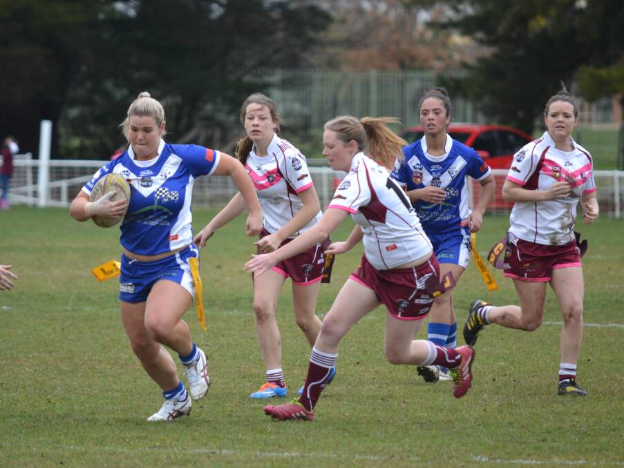 CAN’T TOUCH THIS: Nicole Schneider makes a line break for St Pat’s, which led to a try at the end of the set, in the Saints’ 22-6 win over the Blayney Bears yesterday in the Group 10 ladies’ league tag qualifying final. Photo: ALEXANDER GRANT 	082315agpatstag1