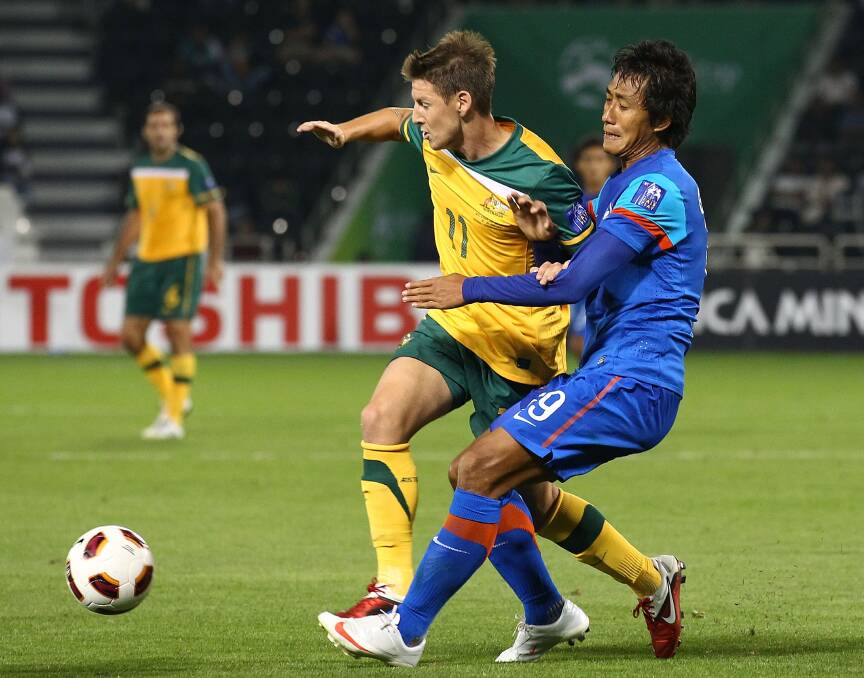 BURNS-ING DESIRE: Nathan Burns in action during the AFC Asian Cup match between India and Australia at Al-Sadd Stadium in January 2011 in Doha, Qatar. He is hoping to play for the Socceroos once again on January 9. Photo: GETTY IMAGES 	nbind1a