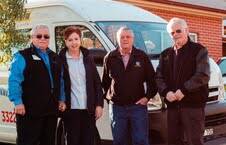 DONATION: BCT president Dominic Chircop, Daffodil Cottage’s Marita Tipene, Bathurst RSL president Ian Miller and Bathurst Panthers chairman Norm Mann with the bus.  	082114transport