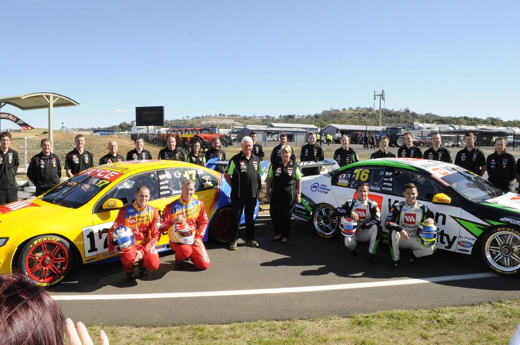 NEW LOOK: The Dick Johnson Racing team line up ahead of their 2014 Bathurst campaign. This year the #17 Falcon of David Wall and Steven Johnson (left) will carry a retro livery. Photo: CHRIS SEABROOK 	100814cdjr1