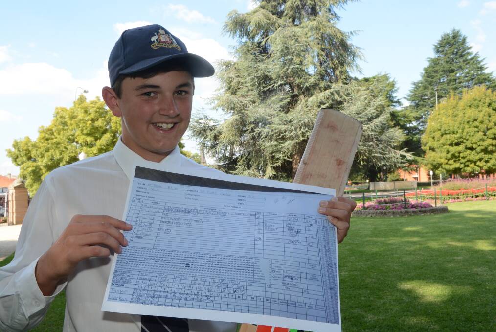 WOW: Ben Mitchell with a copy of the scorecard to remind him, in case he forgets, that at just 14 years of age he scored 221 on Saturday in President’s Cup. Photo: PHILL MURRAY 020916pben