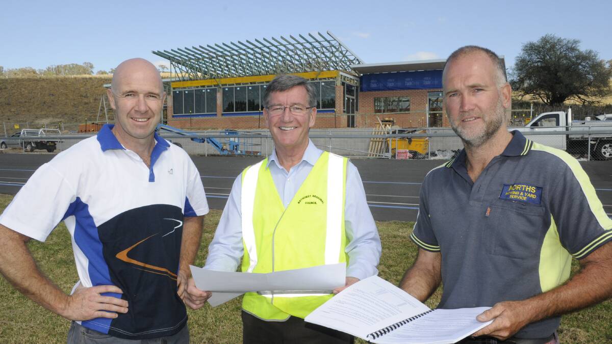 GOING UP: Councillor Greg Westman, mayor Gary Rush and Cr Ian North at the site of the new velodrome on the Vale Road. Photo: CHRIS SEABROOK 030215cvelodrme