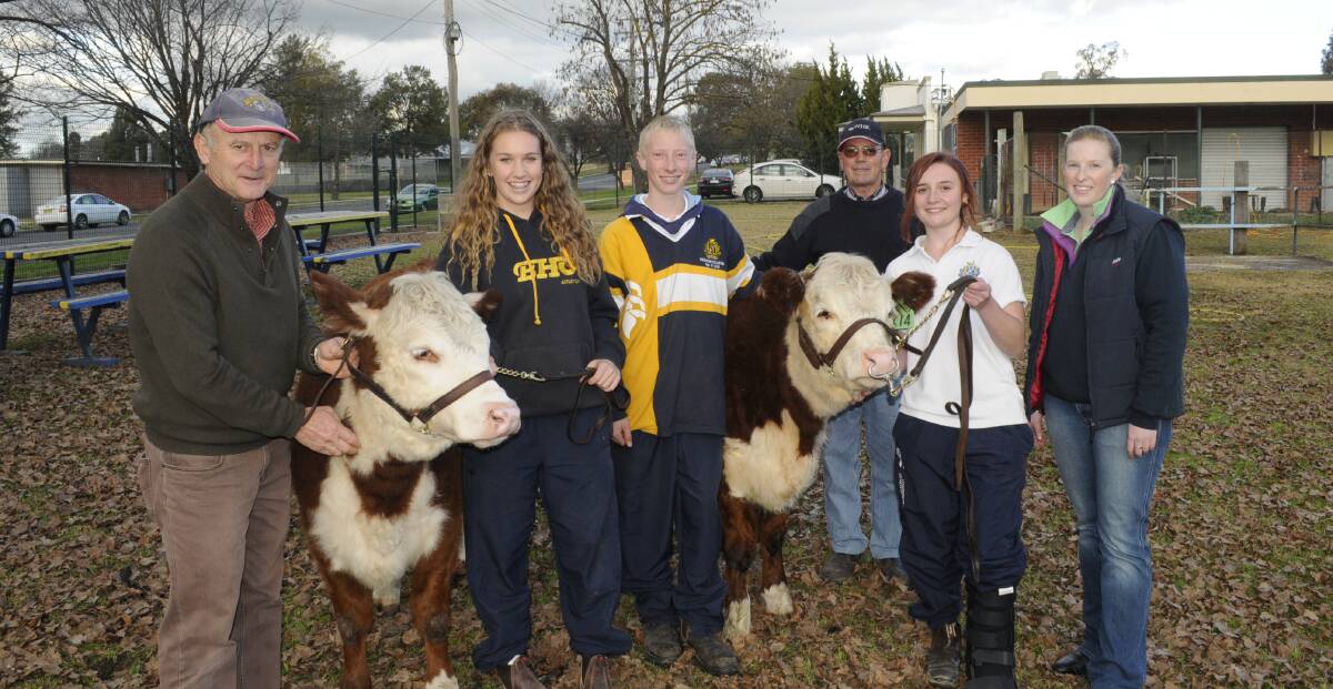 BREEDING GROUND: Peter Matus, Lilly Stocks, Matthew McCauley, Wanera Poll Hereford Stud owner Tony Keech, Simone Roberts and Kate Morris at the Bathurst High agriculture plot. Photo: CHRIS SEABROOK 	062315cattle