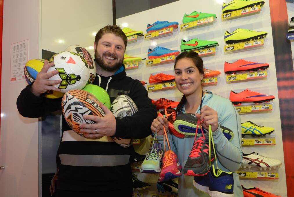 IT’S CRAZY: Matt Willis and Kelly Watson from Sportsco in the Bathurst City Centre are gearing up for Crazy Day. 	082115pcrazy
