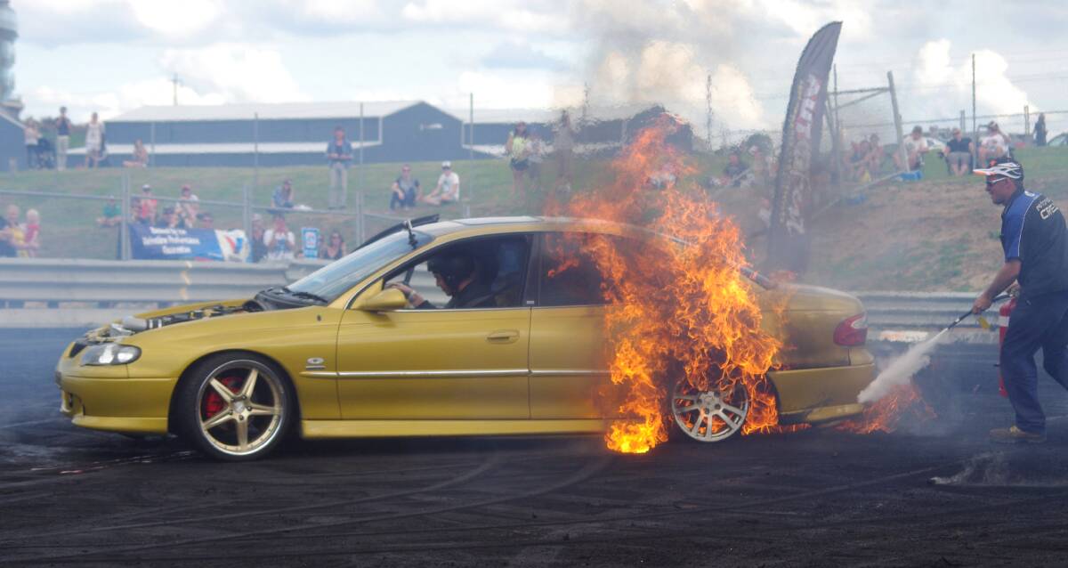 DRAMATIC: Flames accompanied some of the efforts in the burnout competition at the Valvoline Autofest held on the weekend, but it wasn’t an unusual occurrence, according to one of the officials. Photo: WARREN HAWKLESS 	030914wburnout2