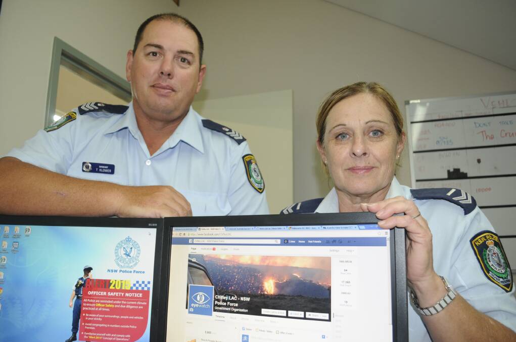 CASTING A WIDE NET: Bathurst police officers Sergeant Troy Klower and Senior Constable Sue Rose with the Chifley LAC Facebook page. Photo: CHRIS SEABROOK 	 032415copage