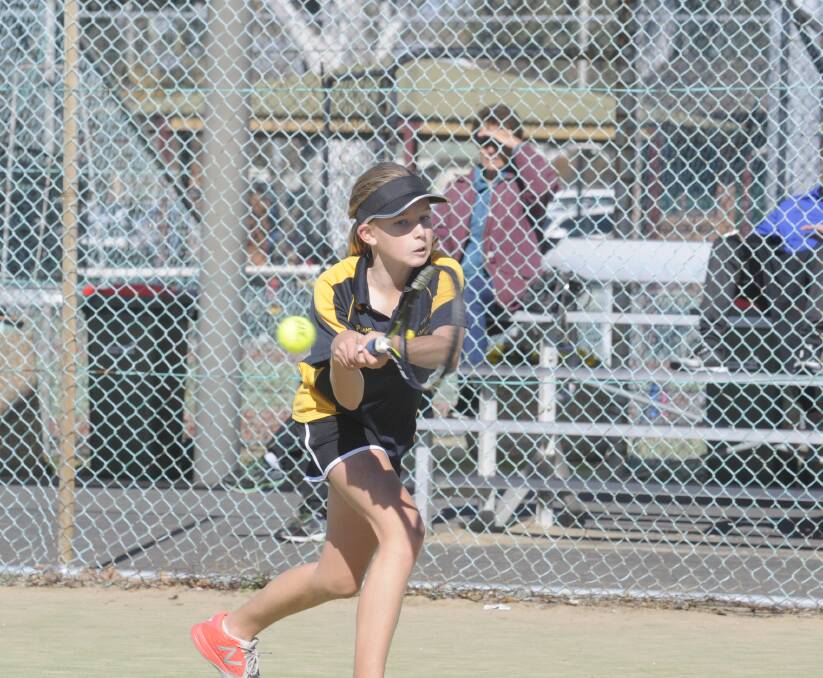 FOCUSED: Tayla Brasier on her way to an under 12s consolation semi-final win at the Bathurst Australian Money Tournament/Junior Tournament over the weekend. Photo: CHRIS SEABROOK 	053016ctennis1b