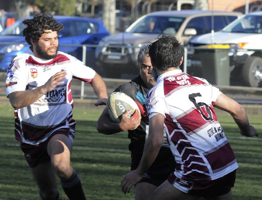 EYES ON THE PRIZE: William ‘Bubba’ Kennedy takes on the Blayney line during Panthers’ 60-16 demolition of the Bears yesterday. Photo: CHRIS SEABROOK 	080314cpan1c