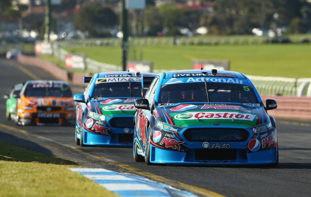 FRONTRUNNERS: Prodrive Racing team-mates Mark Winterbottom (front) and Chaz Mostert (second) have between them claimed the last two editions of the Bathurst 1000. They also occupy the top two spots in this year’s V8 Supercars drivers’ championship. Photo: GETTY IMAGES 	100415Ford12