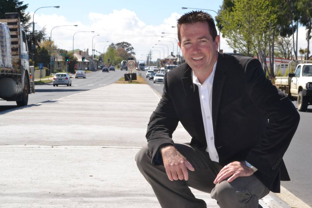 LET’S GET STARTED: Member for Bathurst Paul Toole in the middle of the Great Western Highway at Kelso, which is set for an $85 million upgrade. 	100914roadworks