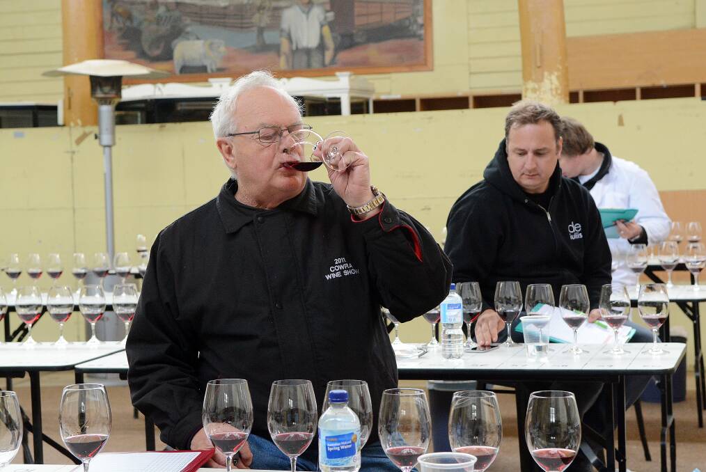 LIP SERVICE: Lester Jesberg from Winewise Magazine is one of the judges at the National Cool Climate Wine Show, and he knows what he’s looking for in a drop. Photo: PHILL MURRAY 	101414pwine2