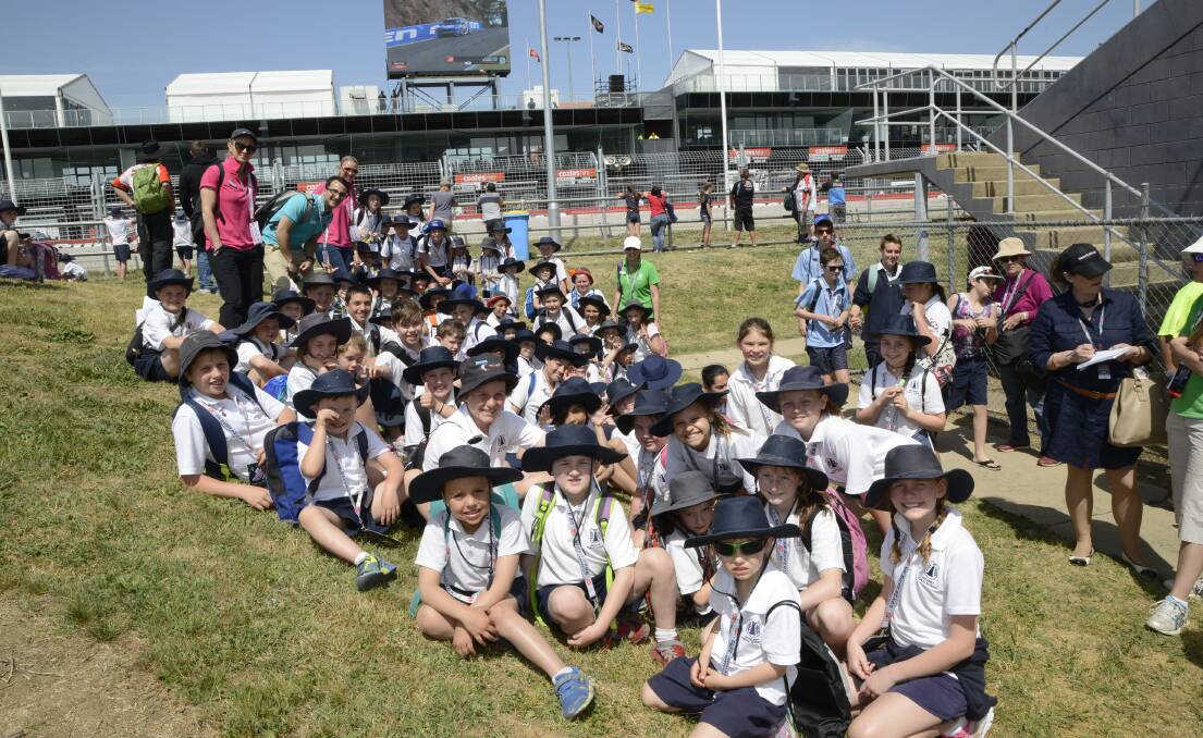 TRACKSIDE: Bathurst Public School students at Mount Panorama yesterday as part of the Students On The Track program. 	100815pbxpublic