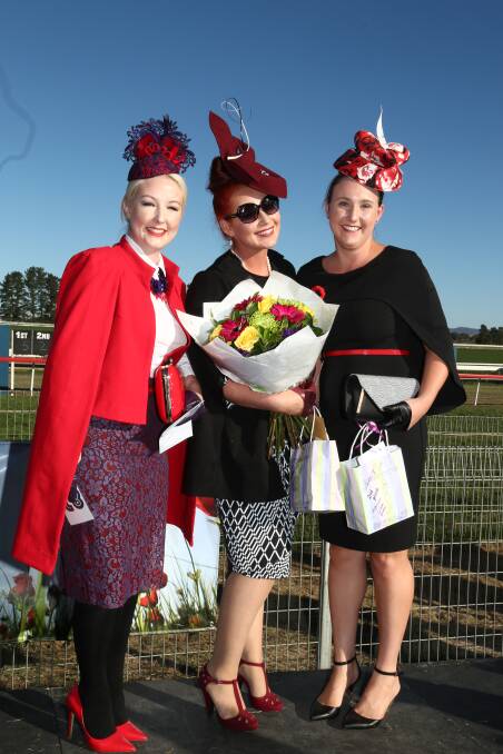 FASHIONABLE: Georgie Townsend (centre) was first in the contemporary female category at the Fashions on the Field at the Soldier’s Saddle race day yesterday, Natalie Hart (right) was second and Michelle Myers third. Photo: PHIL BLATCH 	042516pbfash1