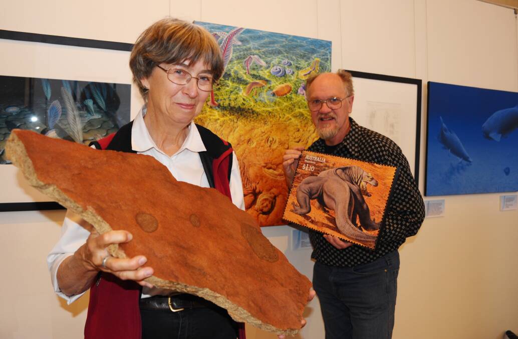 HISTORY REPEATING: Palaeontologist Professor Patricia Vickers-Rich and artist Peter Trusler show off some of the items in a new exhibition opening at the Australian Fossil and Mineral Museum. Photo: ZENIO LAPKA	 071014zfossil2