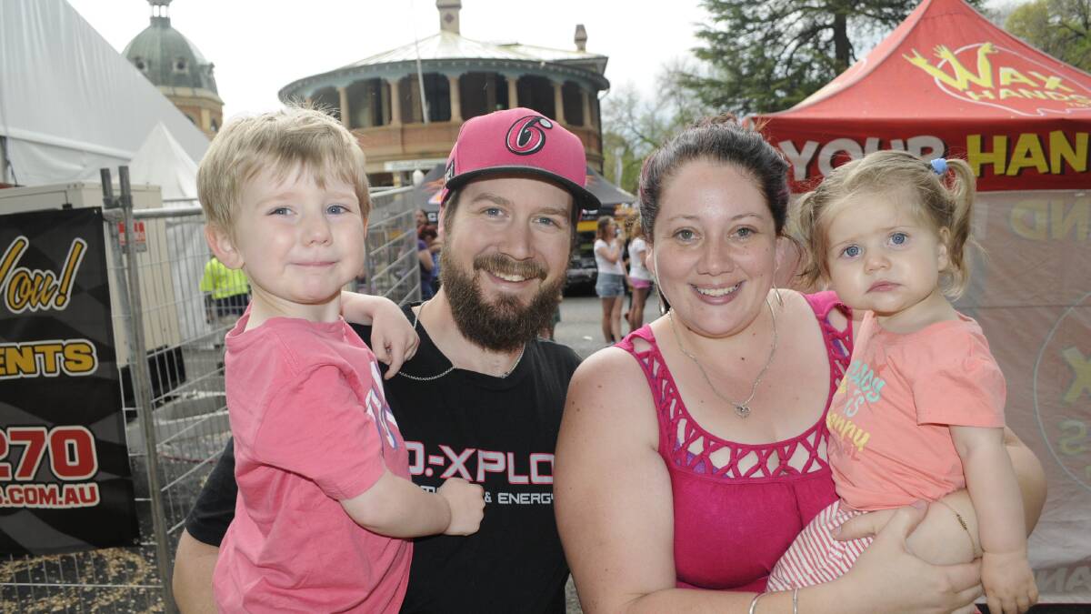 FAMILY FUN: Nathan and Hollie Ulbricht and their children Samson, 3, and Cadence, 1, were among those who attended the Saturday Street Fair. Photo: CHRIS SEABROOK 	101015cfair4
