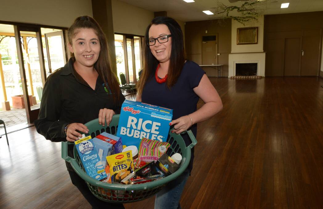 HELP NEEDED: Michelle Bawden and Rebecca Mathie at the Bathurst City Community Club food bank, which is asking for donations of fresh fruit and vegetables. Photo: PHILL MURRAY 	030315pfood