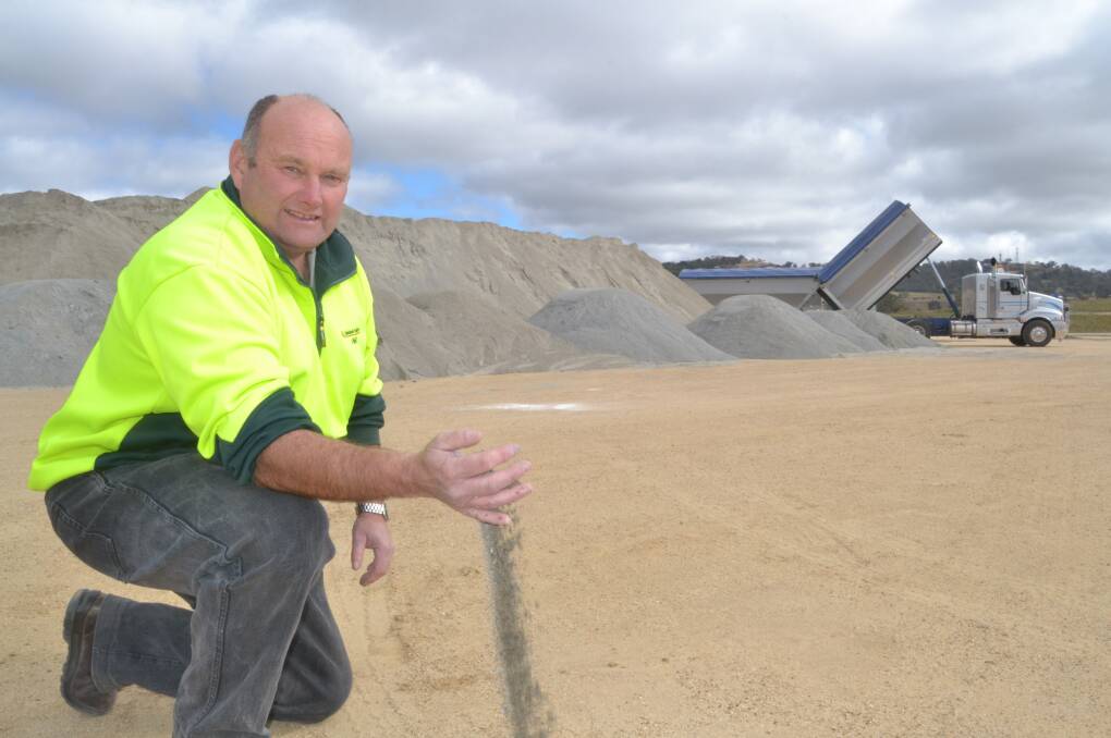 NEED FOR SPEED: Tablelands Builders project manager Phil Hampton with a stockpile of hundreds of tonnes of the special material that will become the surface of the track at the new harness racing complex on the Vale Road. Photo: BRIAN WOOD