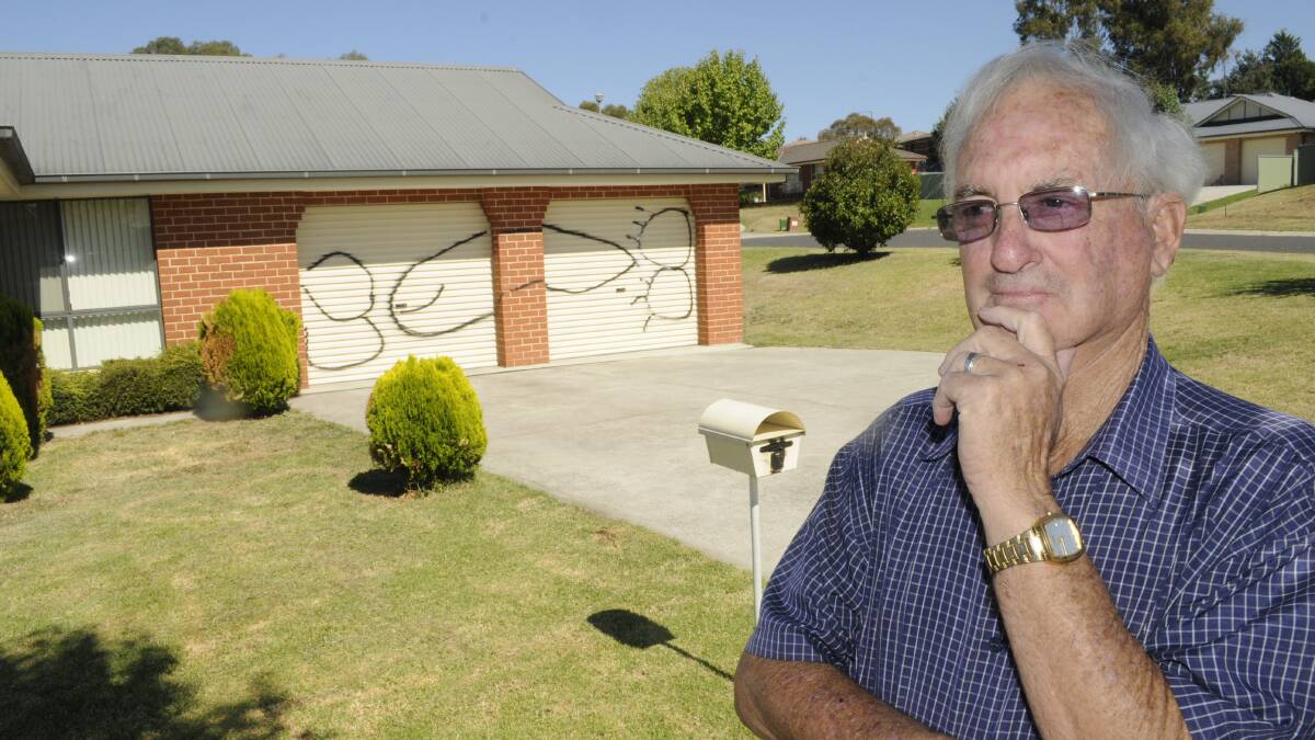 HELL: Alf Shaw outside the Kelso home he shares with Maria Sargent. They say they are being harassed by vandals. Photo: CHRIS SEABROOK 	022415cvandls