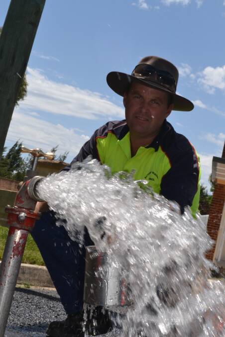 ALL CLEAR: Andrew Nixon was among the team working on Bathurst Regional Council’s extensive water system flushing yesterday to remove residual manganese from pipes. Photo: BRIAN WOOD	 121614flush2