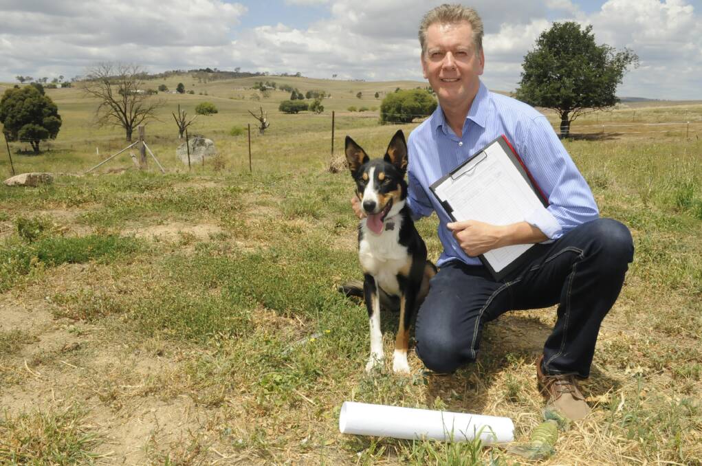 BATTLE READY: Dunkeld resident Brendan McHugh, pictured with his dog Charlie, says his family is ready to take Bathurst Regional Council to court after it twice
knocked back his proposed pet boarding kennel. Photo: CHRIS SEABROOK