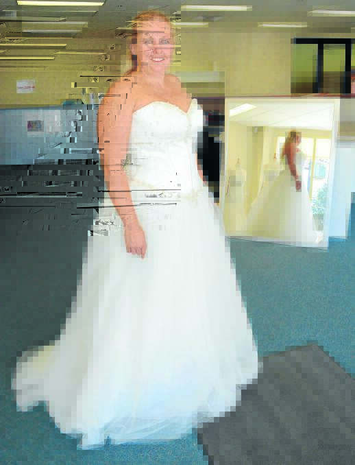 BLUSHING BRIDE: Bride-to-be Sheeny Platt is one of more than 20 women who have chosen a pop-up bridal gown shop to kick off their wedding dress shopping. The shop supports local charity Glenray Industries. Photo: PHILL MURRAY	 032015pwedding