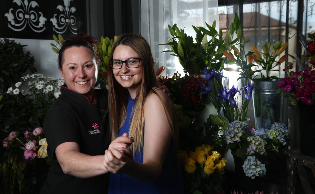 READY TO DANCE: Vanessa Pringle and Charles Sturt University organiser Kayla Cohen are excited to see all the action on the floor at Bathurst Panthers tonight. Photo: PHIL BLATCH  	 111915pbdance2