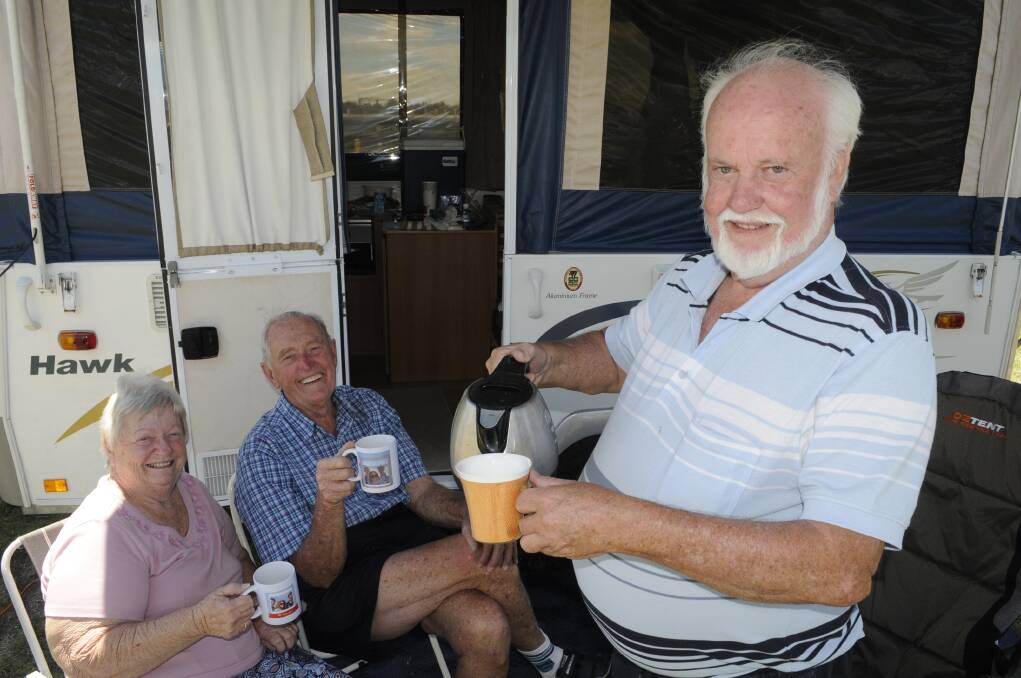 TIME FOR A CUPPA: Rae and Graham Angus with their friend Peter Smith at Mount Panorama yesterday. Photo: CHRIS SEABROOK 	020216camprs