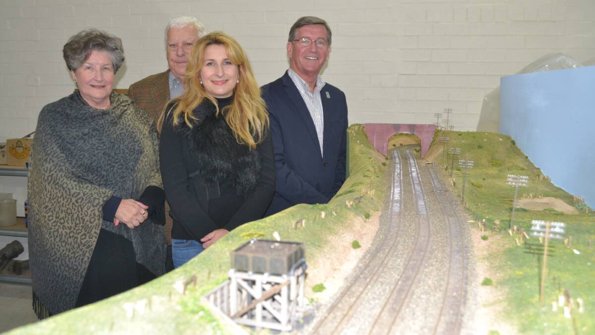 KIND DONATION: Bonny and Paul Hennessy with their daughter Siobhan, who donated their family’s huge model railway of the Bathurst to Tarana line to Bathurst Regional Council. Mayor Gary Rush accepted the donation on council’s behalf. Photo: NADINE MORTON	042015nmtrain2