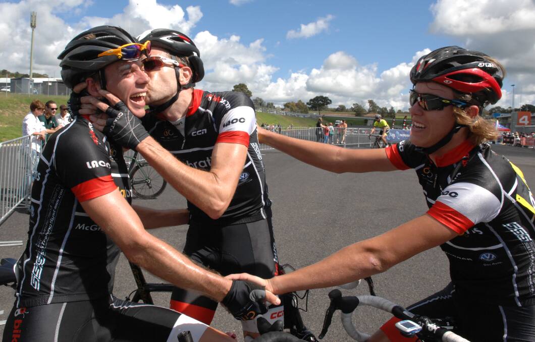 SMOOCH FOR SUCCESS: Blayney to Bathurst winner Josh Berry receives a celebratory kiss from a team-mate after taking out overall honours in the long course event held yesterday. Photo: ZENIO LAPKA	 040614zcyclo81