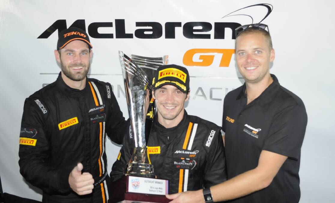 GRINNERS: Shane Van Gisbergen, Alvaro Parente and Jonathon Webb from the Tekno Autosports team, who won the Bathurst 12 Hour in a McLaren 650S, with the main trophy. Photo: CHRIS SEABROOK 	020716cwinrs