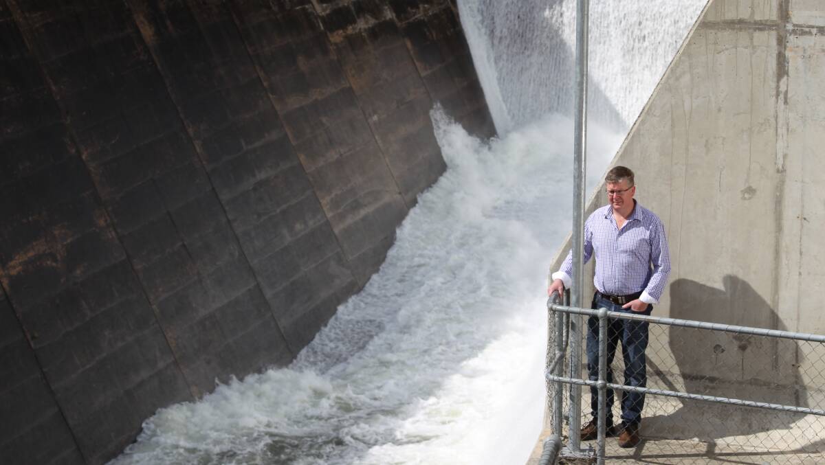 ABUNDANCE: Cr Michael Coote at the spillway of Chifley Dam, which has just reached 100 per cent capacity. Photo: PHIL BLATCH 082615pbdam4