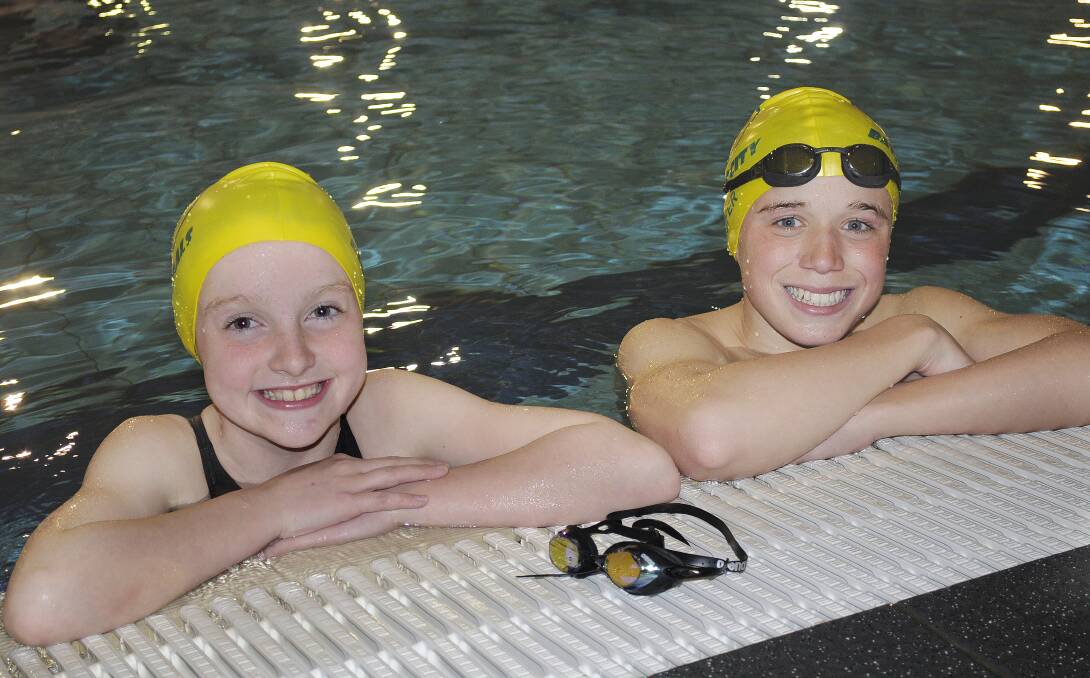MAKING A SPLASH: Left, Zara Grout, 10, and Thomas Geyer, 14, will compete at the NSW State Age Short Course Championships. Photo: CHRIS SEABROOK	082614cswimrs