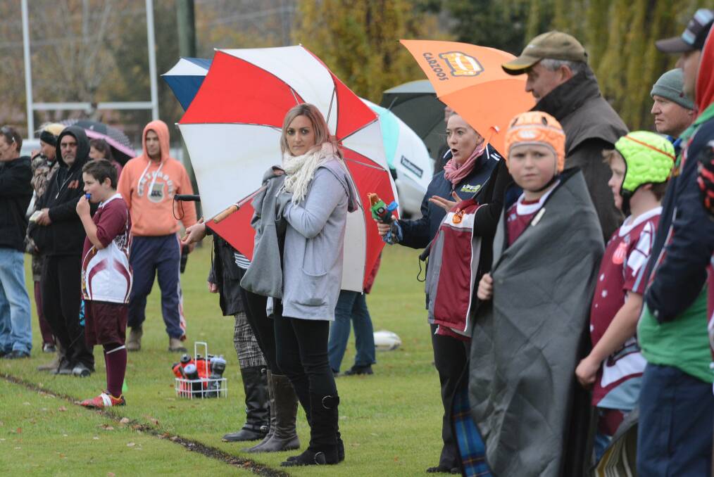 RAINY DAY: Cold and wet weather may be predicted to continue for the next week in Bathurst, but supporters at the Blayney and Bathurst West Public School Open PSSA Primary Rugby League competition yesterday were prepared. Photo: PHILL MURRAY	 052616pweather