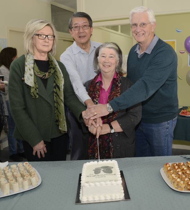 HAPPY BIRTHDAY: The Neighbourhood Centre manager Jean Fell, Dr Theam Khoo, Pat Cutts and Geoff Finall cut the birthday cake during 40th birthday celebrations yesterday. Photo: PHILL MURRAY 051116pBnc