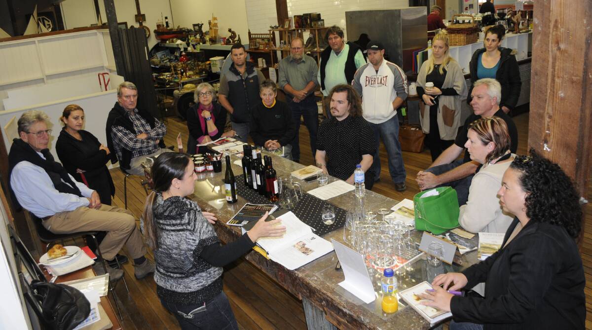 ILLUMINATING: Wines of Bathurst social media co-ordinator Michelle Kerr speaks to local food and wine providers about plans for next month’s  Bicentenary Night Illumination and Street Festival. Photo: CHRIS SEABROOK	 042715cbxwines