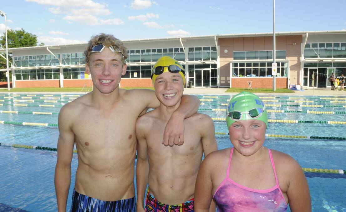 GOOD HOSTS: Zac Telfser, Tom Geyer and Jasmine Gold are part of a 46-strong Bathurst City Amateur Swim Club team to take on their home meeting this Sunday. Photo: CHRIS SEABROOK 111914cswimrs1