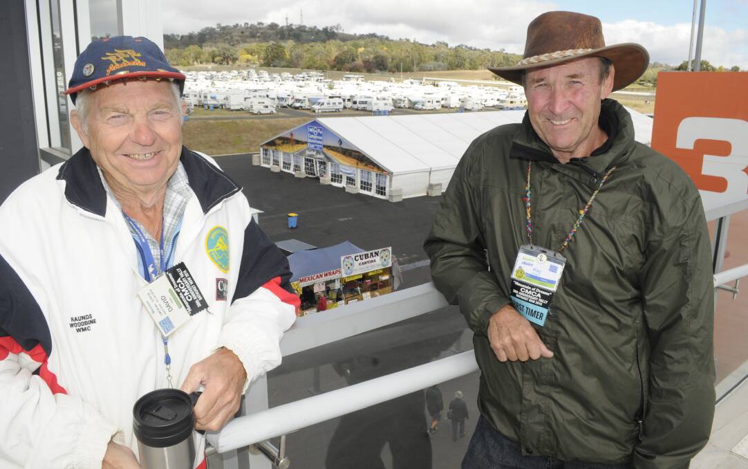 AT HOME ON THE MOUNT: David Dean from the United Kingdom and Ray Wright from Toowoomba are thoroughly enjoying the CMCA 30th Anniversary Rally in Bathurst this week. Photo: CHRIS SEABROOK 042416cmca1