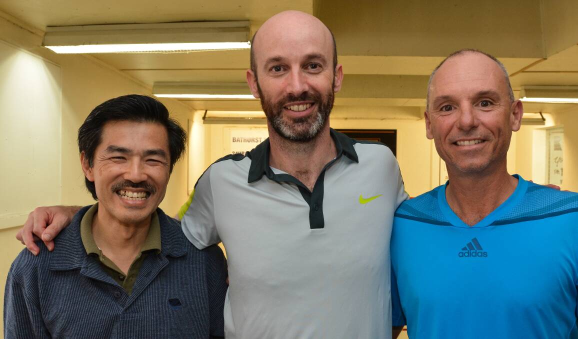 HOLDING ON: Tony Whackett (right) held on to claim victory in his return to competitive squash on Sunday, winning division one in the Bathurst Masters over Simon Hine (centre). Peter Chang (left) claimed the division two win. Photo: ZENIO LAPKA 041915zsquash-1