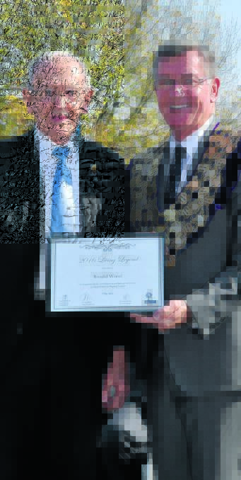 LIVING LEGEND: Ron Wood receiving his Living Legend plaque from Mayor Gary Rush on Proclamation Day this year. ronwoodlivinglegend