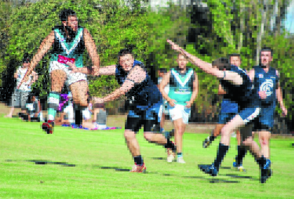 OFF WE GO: Bathurst Bushrangers’ Emmitt Carr-Smith boots the ball long in his team’s win over the Cowra Blues on Saturday. Photo: ANDREW FISHER 	041115smith