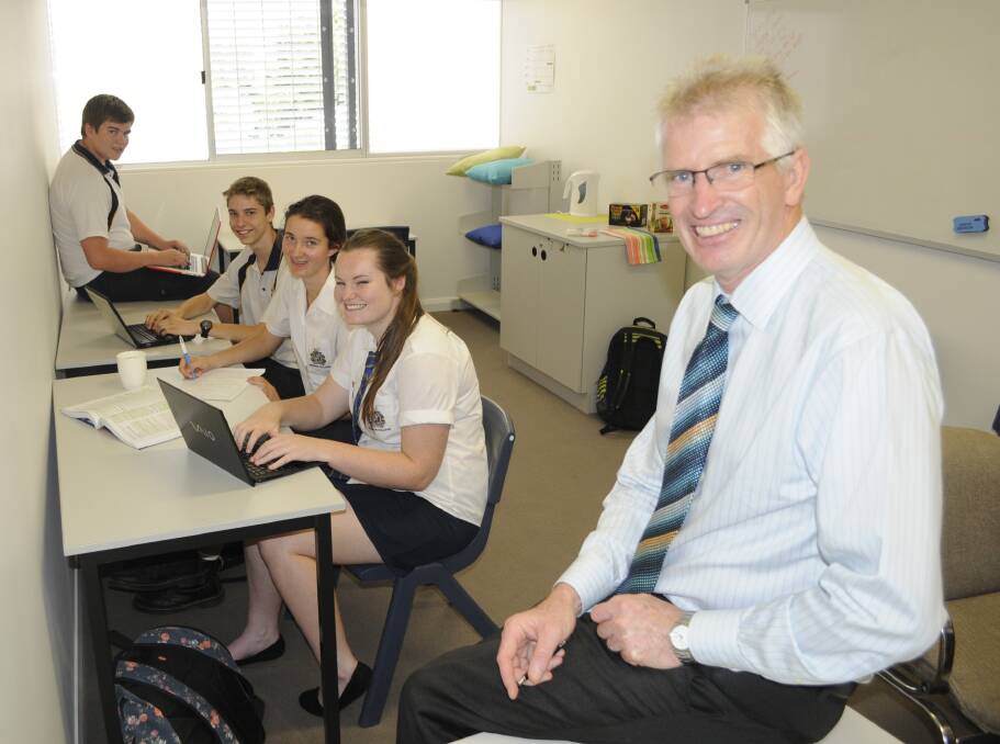 GOOD USE: New seminar rooms at Bathurst High School have been used for study breaks by Year 12 students including Storm Bartlett, Bradley Stratton, Katharine Hogan and Eily Fidock, pictured with principal Geoff Hastings. Photo: CHRIS SEABROOK 031015cbhs